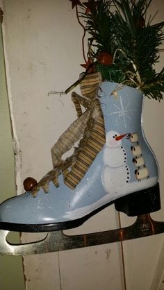 a snowman boot is hanging on the wall