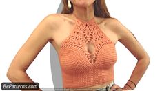 a woman wearing an orange crochet top with her hands on her hips