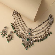 Discover Advaita Moissanite Silver Layered Necklace Set | Paksha Silver Emerald Necklace With Stone Work For Wedding, Traditional Silver Necklace With Emerald Stone Work, Traditional Silver Emerald Necklace With Stone Work, Silver Emerald Necklace With Intricate Design, Silver Emerald Necklace With Stone Work For Festive Occasions, Elegant Silver Emerald Necklace With Stone Work, Festive Silver Emerald Necklace With Stone Work, Luxury Green Jewelry For Festivals, Silver Kundan Necklace With Hand-set Emeralds