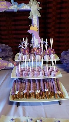 a table topped with lots of purple desserts