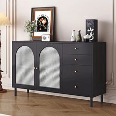 a black and white sideboard in a room