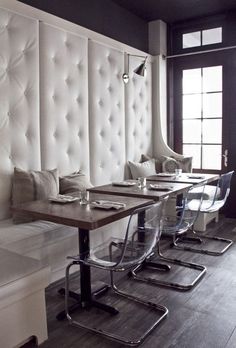 a row of tables sitting next to each other on top of a hard wood floor