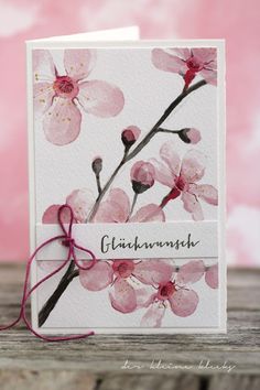 a card with pink flowers on it