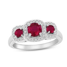 This vintage-style engagement ring fashioned in 14K white gold features a trio of round rubies, the largest being 5.4mm in size, set across the center of the ring. A cushion-shaped frame of diamonds totaling 1/5 cts., each with a color ranking of H and clarity of Si2, surround the rubies. Vintage Style Engagement Rings, Three Stone Engagement Ring, Stone Engagement Ring, Three Stone Engagement, Ruby Jewelry, Three Stone Engagement Rings, Stone Engagement, I Love Jewelry, Ruby Ring