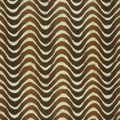 an abstract pattern with wavy lines in brown and white