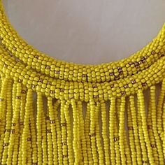 Handmade Yellow Bib Necklace, Handmade Long Beaded Necklaces For Celebration, Yellow Beaded Costume Jewelry Necklace, Handmade Gold Beaded Costume Necklace, Yellow Necklaces With Dangling Beads, Unique Gold Beaded Necklace For Gifts, Unique Gold Beaded Necklaces As Gift, Yellow Round Beads Jewelry For Celebration, Unique Beaded Necklaces With Gold Beads As Gift