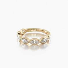 a gold ring with three diamonds on it