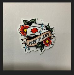 a sticker with the words work of heart on it