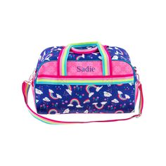 a blue duffel bag with unicorns and rainbows on the front, personalized