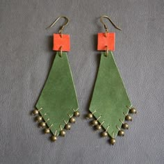 two pairs of green and orange earrings