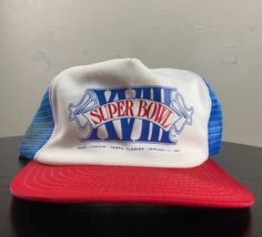 Vintage Super Bowl XVIII Hat Great Vintage Condition Made by AJD in the USA OSFA One Size Fits All *Follow LegacyVintage on Instagram* * I ship all items in two or three business days and utilize Priority Mail options via USPS. Expedited shipping is available upon request. If you have any questions; Please Ask! * All of my items are pre-owned and, unfortunately, sometimes have scuffs, stains, or other signs of pre-lovin'. I will always list any major damage and often will include photos.  * I'm Retro Trucker Hat For Sports Events, Retro Baseball Cap For Sports Events, Vintage Curved Brim Trucker Hat For Sports, Vintage Trucker Hat For Sports Events, Vintage Trucker Hat For Streetwear, Los Angeles Raiders, Vintage Cap, Vintage Football, Vintage Sports