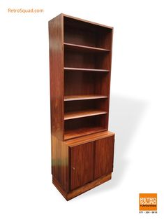 a wooden bookcase with two doors and drawers