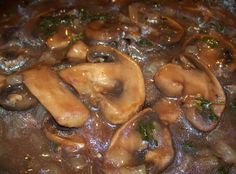 mushrooms and broccoli cooking in a pot