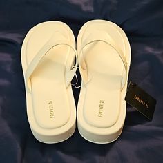 Forever 21, New With Tags. White Size 8 Platform Sandal/Flip Flops.Platform Just About An Inch Tall, A Little Higher By The Heel. Please See Photos. Trendy Flip Flops For Beach Season Day Out, Forever 21 Casual Synthetic Sandals, Forever 21 Round Toe Beach Sandals, Forever 21 Sandals For Beach With Round Toe, Forever 21 Open Toe Sandals For Vacation, Forever 21 Synthetic Sandals For Spring, Forever 21 Sandals For Spring Vacation, Forever 21 Sandals For Vacation In Spring, Trendy Forever 21 Sandals For Vacation