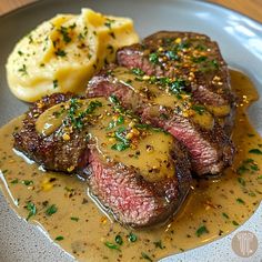 steak, mashed potatoes and gravy on a plate