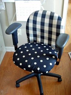 an office chair with black and white polka dot fabric