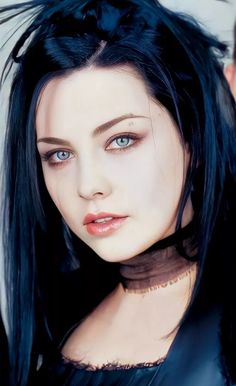 a woman with long black hair and blue eyes