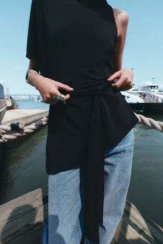 ASYMMETRICAL BELTED TOP - Black | ZARA United States Black Summer Tops With Tie Waist, Chic Tie Waist Top For Night Out, Chic Summer Belted Tops, Black Tie Waist Top For Spring, Zara Asymmetrical Tops For Day Out, Casual Asymmetrical One Shoulder Top For Day Out, Zara Top With Asymmetrical Neckline For Summer, Zara One-shoulder Top For Day Out, Chic Summer One Shoulder Top With Short Sleeve