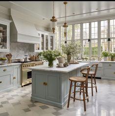 a kitchen filled with lots of counter top space next to a stove top oven and sink