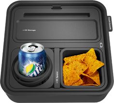 a lunch box with chips and a can of soda