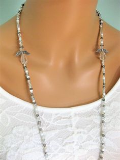 "Silver and clear beaded Eyeglass Chain, and Necklace with Angels, handmade by Ralston Originals. This is a unique original style Eyeglass Chain and Necklace combination designed by Ralston Originals. Unique from any other Eyeglass Chains on Etsy, Ralston Originals was the first to add the lobster clasp at the end of the chain to join together to make a Necklace. Brilliant! This makes it even more unique because you now have two pieces of jewelry in one!!. Wear it to work or out shopping as a Ne Gift Crystal Beaded Necklaces, Gift Crystal Beaded Necklaces In Clear, Clear Beaded Glass Necklaces, Clear Glass Beaded Chain Necklace, Adjustable Glass Beaded Necklaces With Wire Wrapping, Adjustable Clear Beaded Necklaces As Gifts, Adjustable Clear Beaded Necklace For Gifts, Handmade Clear Beaded Necklaces For Jewelry Making, Adjustable Glass Beaded Necklace With Wire Wrapped