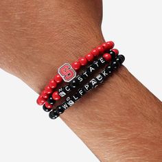 A whole new way to rep the team in style is here. Step up your fan fashion sense with this NC State Wolfpack 3 Pack Beaded Friendship Bracelet. These matching friendship bracelets have an all-over team-colored design and team logo displays, which makes them the perfect way to show your support for the NC State Wolfpack on gamedays and every day in between. Every bead bracelet design is the perfect addition to your outfit, whether you’re heading to the game, watching at home, or just hanging out Matching Friendship Bracelets, Nc State Wolfpack, Friendship Bracelets With Beads, Fan Fashion, Beads Bracelet Design, Nc State, Bracelet Design, Wolf Pack, Friendship Bracelet