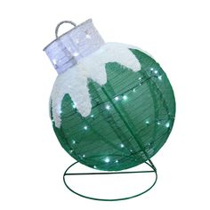 a green and white christmas ornament with lights on it's top, sitting on a stand