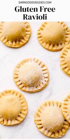 small pies with powdered sugar on them sitting on a white counter top next to each other