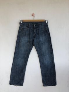 Vintage Levis 569 Jeans Dark Blue Levis 569 Denim Pants - BS40416.  Manual Measurement (laying in flat area):  1) Waist: 34 inch.  2) Rise: 10.5 inch.  3) Hips: 24 inch.  4) Tight: 12 inch.  5) Outseam: 42.5 inch.  6) Inseam: 31 inch.  7) Leg opening: 9 inch.  Fabric Material: 100% Denim Cotton.  Condition: In good vintage condition overall.  Please check all the measurement to ensure a proper fit.  Remember to allow yourself some extra room for movement.  You can compare these information with Casual Straight Dark Wash Jeans, Classic Baggy Dark Wash Jeans, Vintage Baggy Straight Leg Jeans, Medium Wash Straight Pants For Streetwear, Casual Faded Straight Bottoms, Casual Washed Straight Jeans, Casual Straight Faded Bottoms, Straight Medium Wash Pants For Streetwear, Casual Straight Washed Jeans