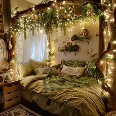 a bed with lots of lights hanging from it's headboard and pillows on top