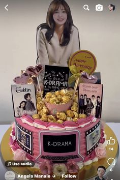 the cake is decorated with many different items and has an image of k - drama on it