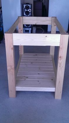 a small wooden table sitting in the middle of a room with shelves on each side