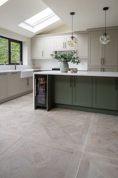 Square wooden tiles laid in a green and cream kitchen Orange Tiles