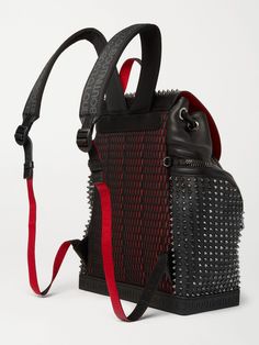 Christian Louboutin's spike-embellished 'Explorafunk' backpack doesn't just look tough, the full-grain leather bag is set on a rubber base that not only protects from scuffs, but also helps it stand up when you're packing or set it down. Adjust the logo-jacquard straps to wear it on-shoulder or cross-body. Leather Streetwear Backpack, Luxury Black Bags With Rivets, Luxury Leather Bags For Streetwear, Leather Streetwear Standard Backpack, Leather Backpack For Streetwear, Luxury Streetwear Standard Backpack, Luxury Backpack For Streetwear, Black Designer Bag With Rivets, Luxury Streetwear Backpack