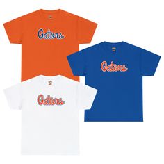 "Gator fans and Florida die-hards, this Florida Cursive Gators shirt is for you! This classic, adult unisex size Florida shirt features the word \"Gators\" in classic cursive Gators font, that wholeheartedly displays your Gator pride for ol' Florida! Sport it proudly on Gator game day in the Swamp, tailgating outside the stadium, or at home in your living room cheering on ol' Florida. Even outside of football season, you're sure to get compliments from fellow Gators while you're out to eat, at t Short Sleeve Team Name Shirt For Fans, Collegiate Short Sleeve Fan Gear Shirt, Pre-shrunk Graphic Tee For Fan Gear, Graphic Tee Shirt With Team Name For Fans, Collegiate T-shirt With Lettering For Sports Events, College Fan Apparel Shirt With Logo Print, Game Day Team-colored T-shirt With Lettering, Casual T-shirt With Lettering For Fans, Team-colored T-shirt With Lettering For Game Day