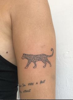 a woman's arm with a tattoo on it that reads, you can make a cat attract