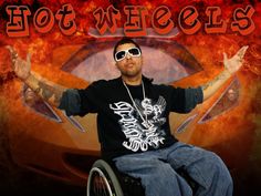 a man in a wheel chair with his arms outstretched