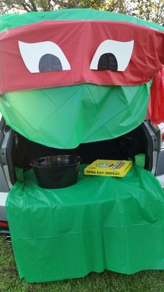 the trunk of a car decorated like a teenage mutant