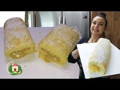 a woman is holding two large pastries in front of her