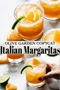 three glasses filled with orange margaritas and garnished with lime, on top of a table