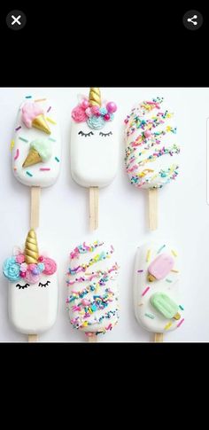 four ice cream pops decorated with unicorn faces and sprinkles