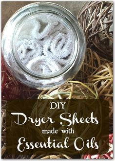 diy dryer sheets made with essential oils in a mason jar on top of wicker baskets