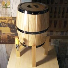 a wooden barrel sitting on top of a table