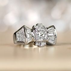 two engagement rings sitting on top of each other