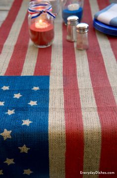 an american flag table cloth with candles on it