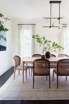 the dining room table is surrounded by chairs