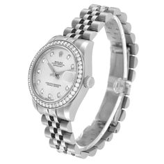 Rolex Datejust Midsize Steel White Gold Diamond Ladies Watch 178384. Officially certified chronometer automatic self-winding movement. Stainless steel oyster case 31.0 mm in diameter. Rolex logo on the crown. 18K white gold bezel set with original Rolex factory diamonds. Scratch resistant sapphire crystal with cyclops magnifier. Silver dial with original Rolex factory diamond hour markers. Date calendar at 3 o'clock aperture. Stainless steel jubilee bracelet with hidden clasp. Fits 6.5" wrist. Timeless Diamond Chronograph Watch, Timeless Round Diamond Watch With Chronograph, White Gold Diamond Watch With Date Display, Elegant Silver Chronograph Watch With Date Indicator, Formal Chronograph Watch With Date Display, Timeless Round Chronograph Watch With Date Indicator, Classic Round Diamond Watch With Date Display, Timeless Round Diamond Watch With Chronometer, Classic Round Diamond Watch With Chronometer