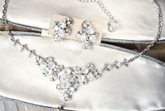 "I am SO excited to be offering this beyond exquisite high-end designer \"ORA\" signed vintage Art Deco 1940s era Old Hollywood Glam lacy clear crystal rhinestone necklace and earrings set! \"ORA\" company was begun in the 1940s by Oreste Agnini and Ralph Singer and is known for their Art Deco designs, quality material, and excellent craftsmanship. Photos honestly, don't even begin to do this set justice or capture the amazing sparkle adequately. The shiny silver rhodium plated lacy elegant neck Wedding Silver, 1920s Vintage, Bridal Choker, Old Hollywood Glam, Elegant Sets, Hollywood Glam, Elegant Necklaces, Rhinestone Necklace, Shiny Silver