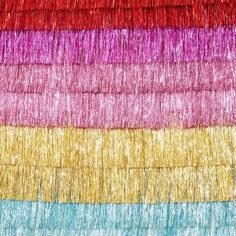 multicolored fabric with fringes on it