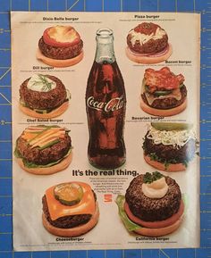 an advertisement for coca cola with hamburgers and other foods